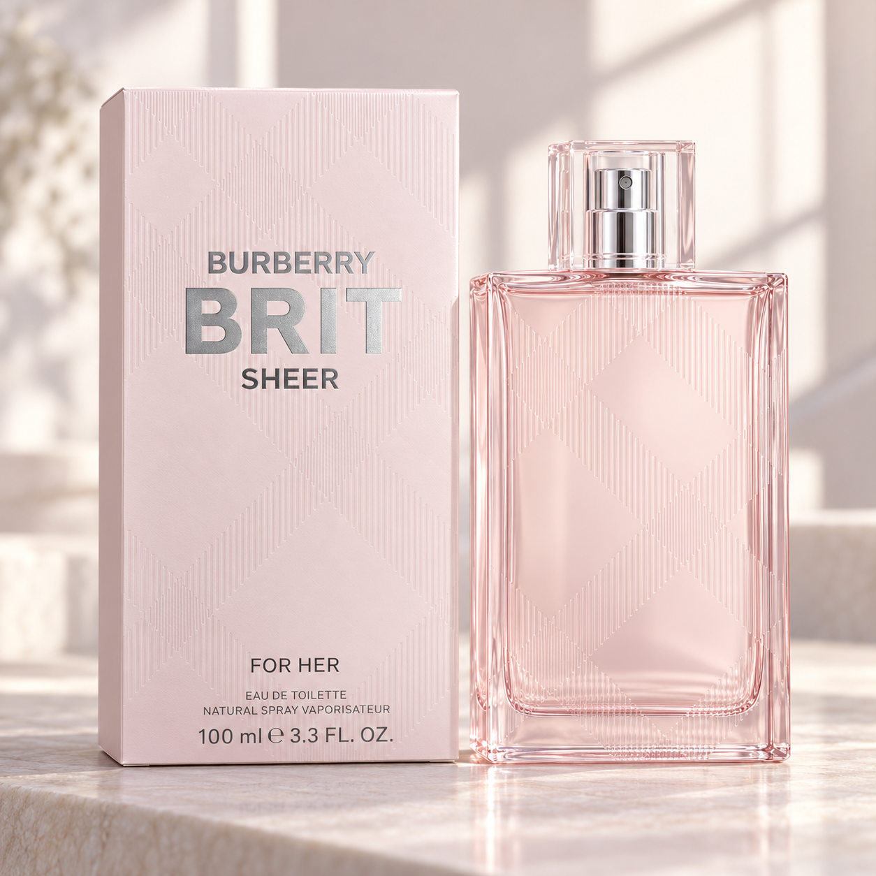 Burberry Brit Sheer 100 ml bottle beside its pink check box